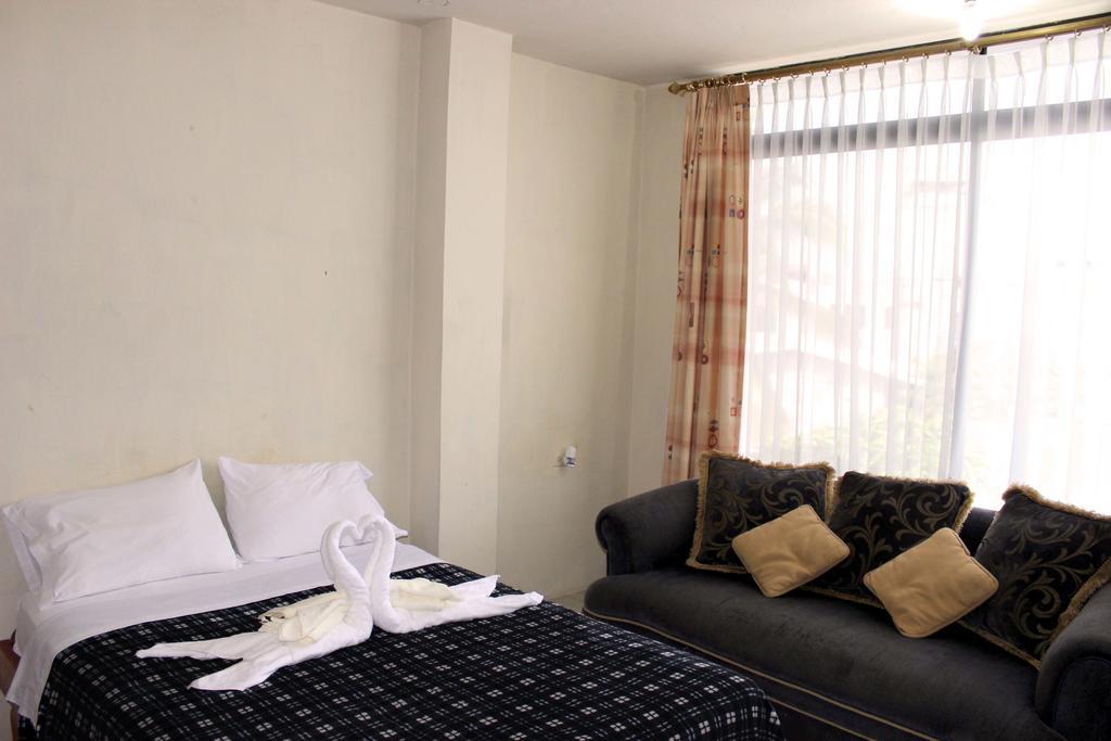 Planet House Hotel ปูแอร์โตอาโยรา ห้อง รูปภาพ