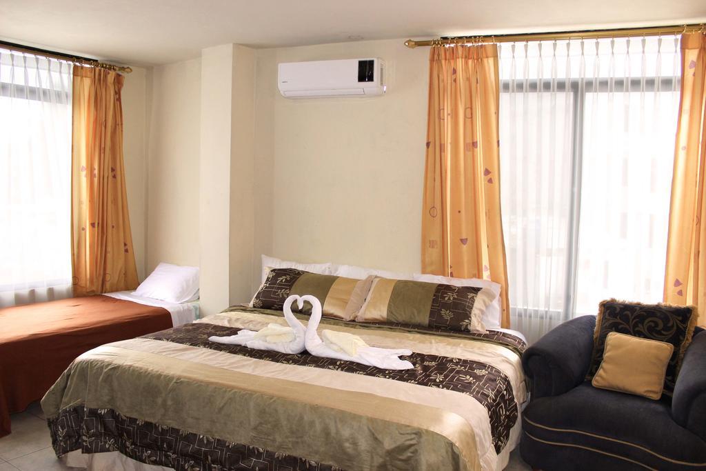 Planet House Hotel ปูแอร์โตอาโยรา ห้อง รูปภาพ